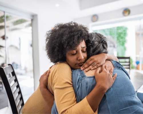 Two women hugging in emotional support